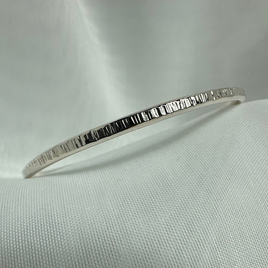 RIDGE Sterling Silver Textured Oval Bangle